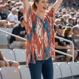 Michael Kors women Top asymmetrical Size Medium Fits XL Flowy Soft Orange Blue